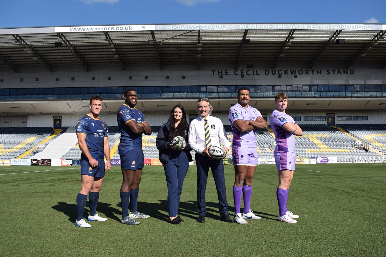 Polly and Richard Manser (both 5 Star Windows & Conservatories) with some of the Worcester Warriors squad
